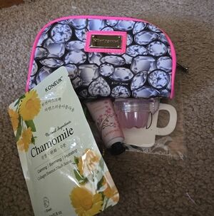Besty Johnson Cosmetic Bag With 9 Beauty Items.